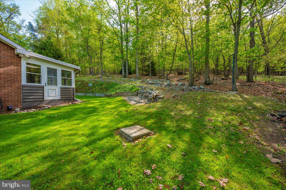13449 Edgemont Road Smithsburg, MD 21783 - Photo 59 of 70 a backyard of a house with lots of green space