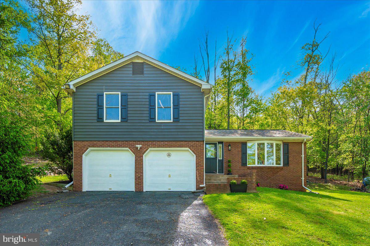 13449 Edgemont Road Smithsburg, MD 21783 - Photo 67 of 70 front view of a house with a yard