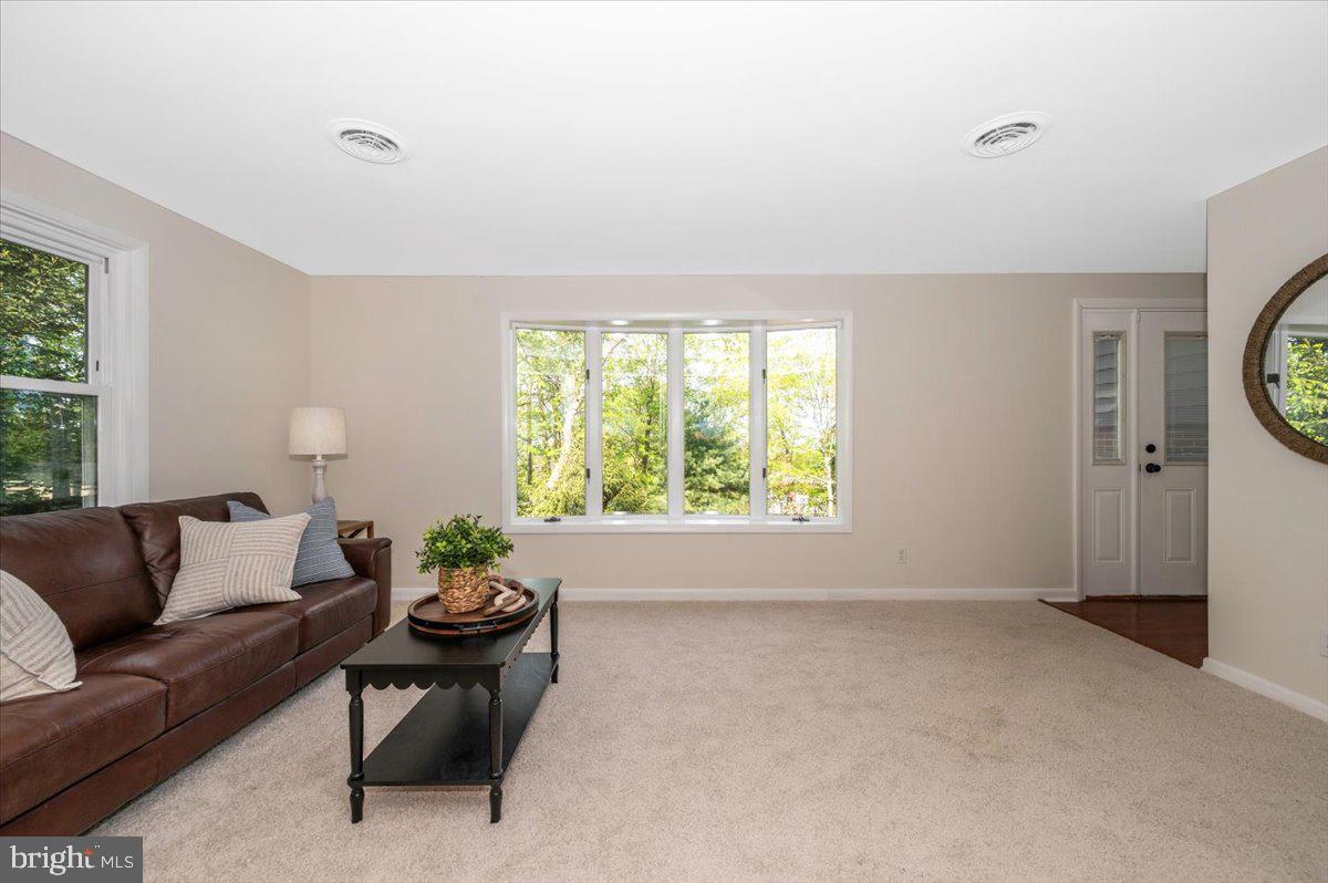 13449 Edgemont Road Smithsburg, MD 21783 - Photo 7 of 70 a living room with furniture and a large window