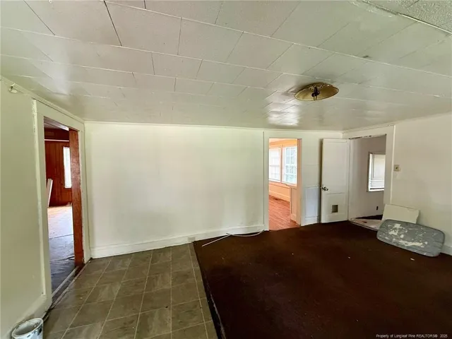 a view of an empty room and window