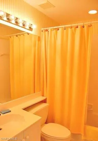 a bathroom with a shower curtain