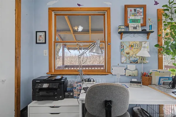 a dining room with furniture and window
