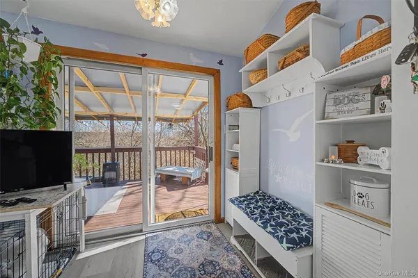 a bedroom with furniture and flat screen tv