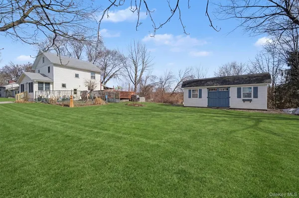 a front view of house with yard and seating area