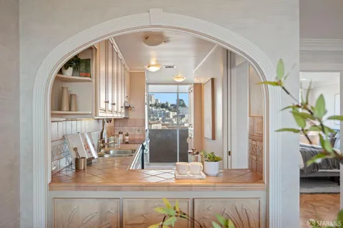 a view of living room with furniture and wooden floor