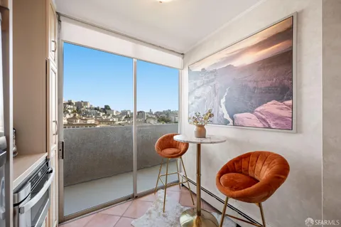 a kitchen with a table and chairs