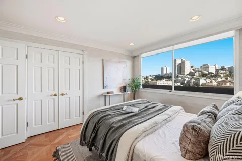 a bedroom with bed and window