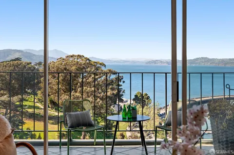 a view of balcony with furniture