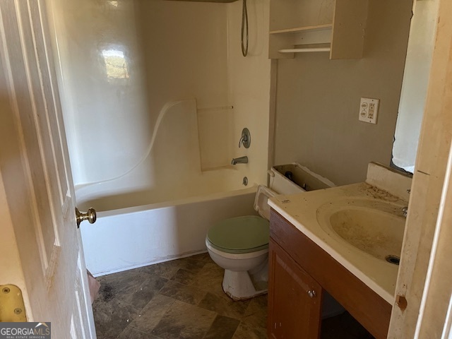 1427 Woodland Road Thomaston, GA 30286 - Photo 16 of 16 a bathroom with a sink and toilet