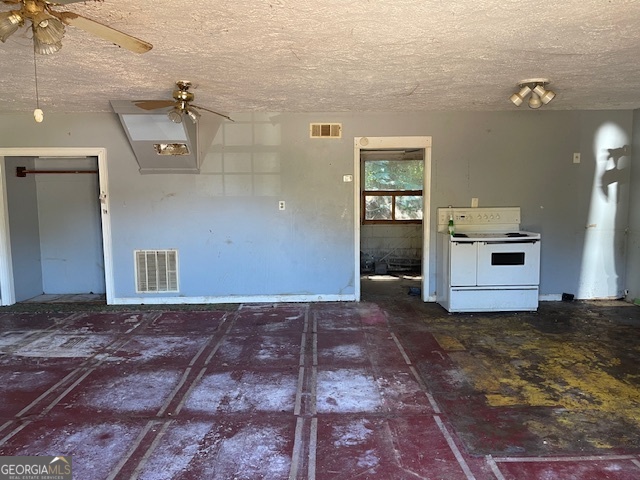 1427 Woodland Road Thomaston, GA 30286 - Photo 2 of 16 a view of a big room with a fireplace and wooden floor