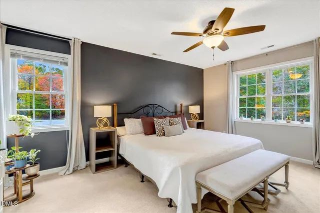 a bedroom with a bed and a table