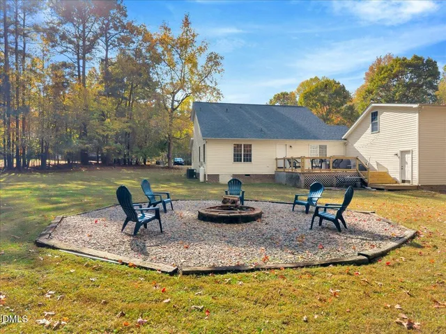 a swimming pool with outdoor seating