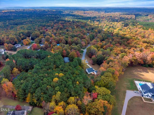 a view of a house with backyard outdoor space and sitting area