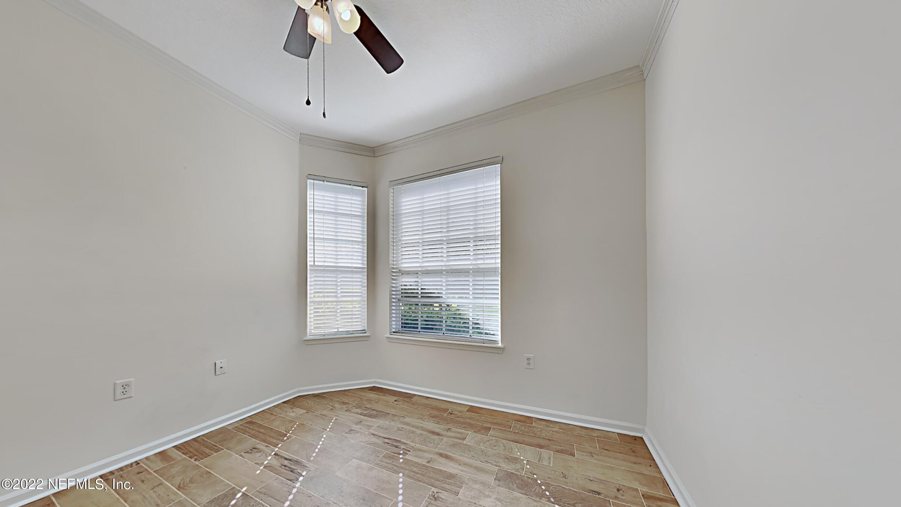 7990 Baymeadows Road, Unit 201 Jacksonville, FL 32256 - Photo 11 of 14 an empty room with a window and a ceiling fan