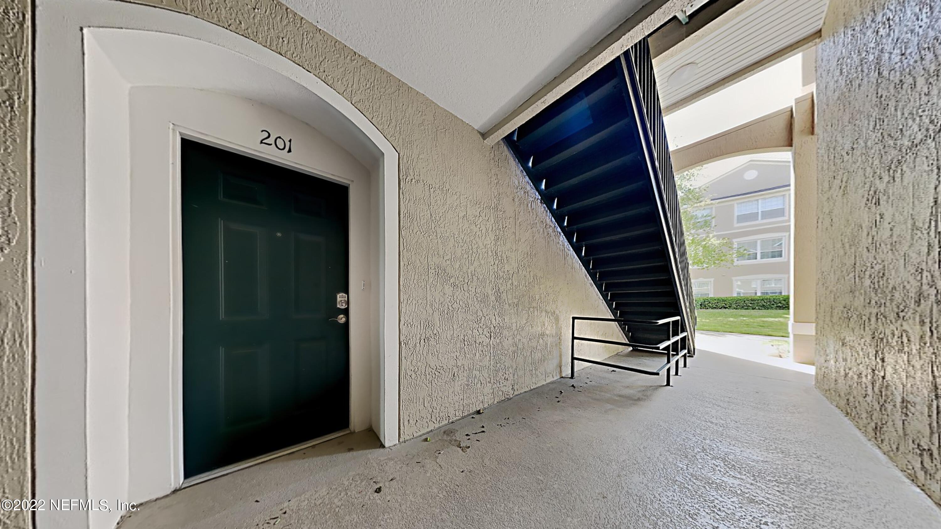 7990 Baymeadows Road, Unit 201 Jacksonville, FL 32256 - Photo 5 of 14 a view of an entryway with a door