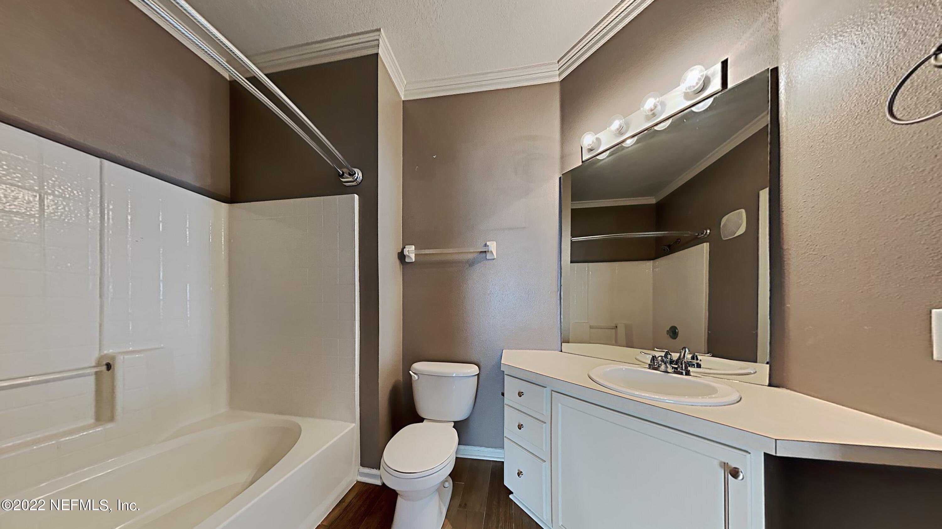 7990 Baymeadows Road, Unit 201 Jacksonville, FL 32256 - Photo 8 of 14 a bathroom with a sink toilet and shower