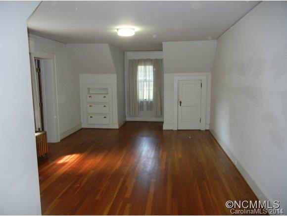 355 South Ridgecrest Street Rutherfordton, NC 28139 - Photo 15 of 24 wooden floor in an empty room with a window