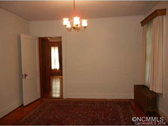 355 South Ridgecrest Street Rutherfordton, NC 28139 - Photo 9 of 24 wooden floor in an empty room with a window