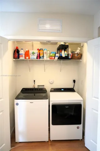 a kitchen with stainless steel appliances a stove and cabinets