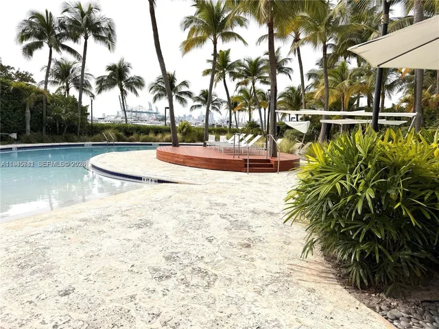 a view of a swimming pool with a patio