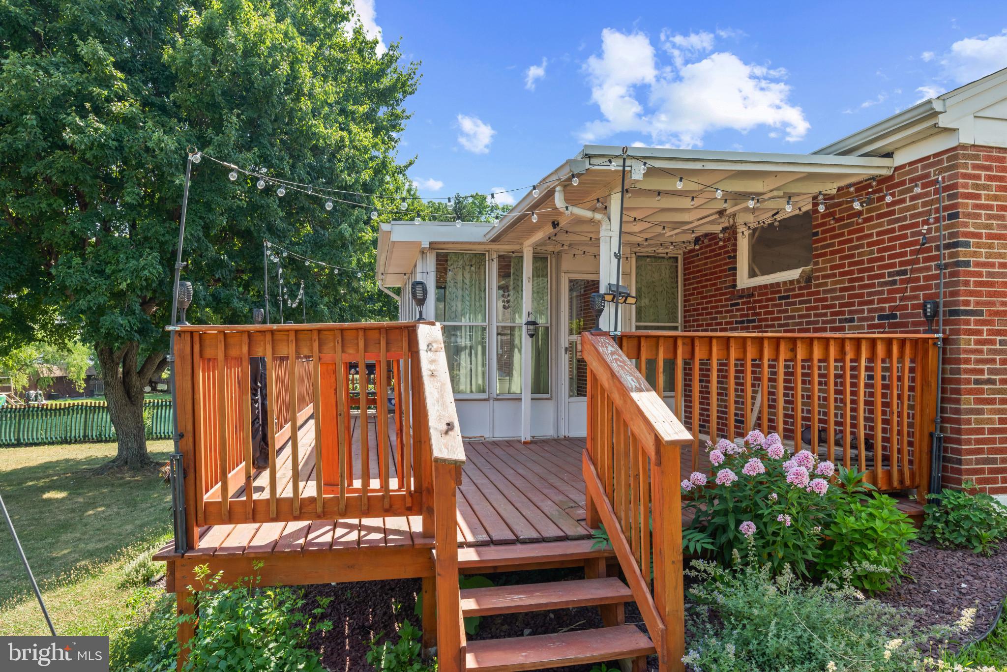 14 Sharon Road Enola, PA 17025 - Photo 31 of 40 Wood-decked patio with steps leading to a sunroom