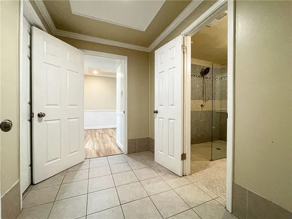 a bathroom with a glass door shower and a sink