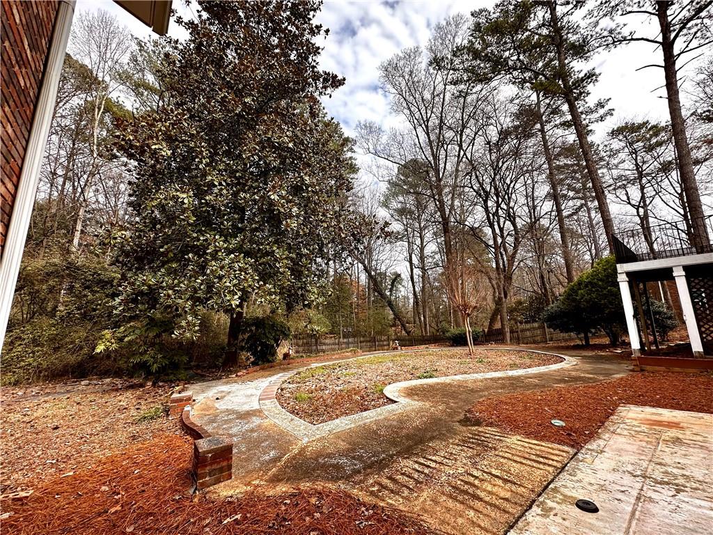 3115 Brookview Road Marietta, GA 30067 - Photo 21 of 31 a backyard of a house with table and chairs