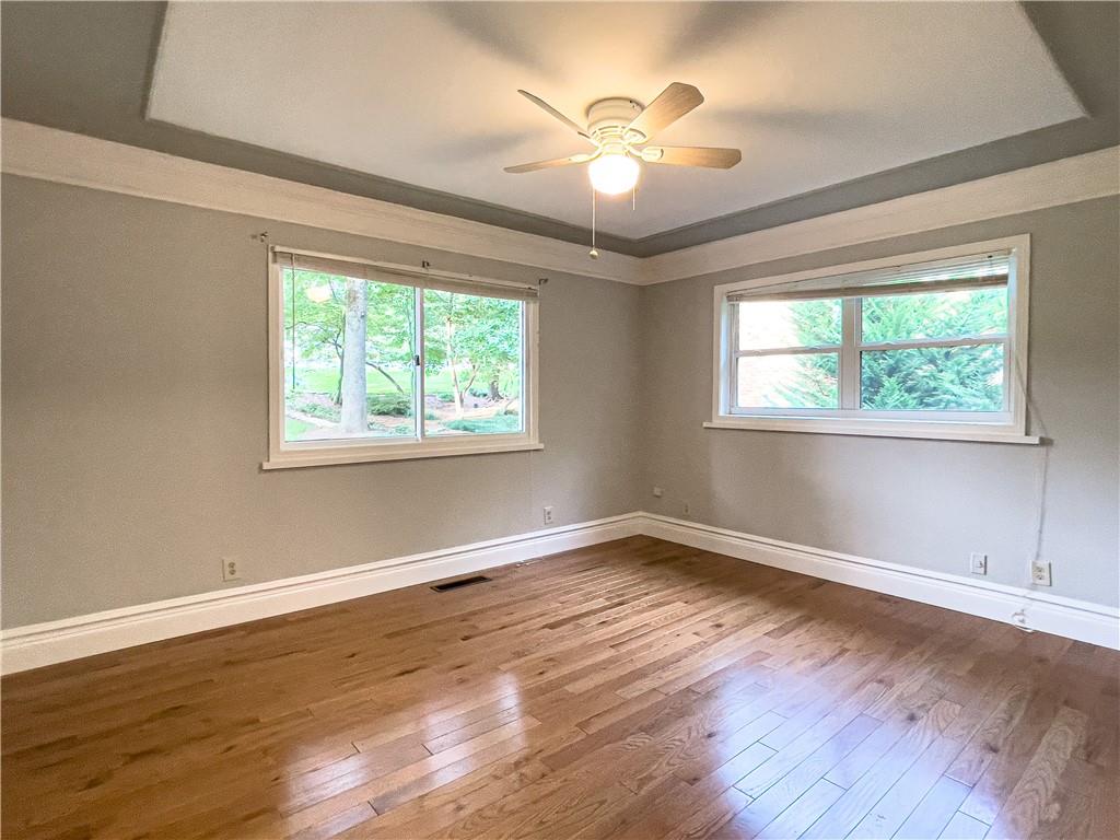 3115 Brookview Road Marietta, GA 30067 - Photo 22 of 31 a view of an empty room with wooden floor and a window