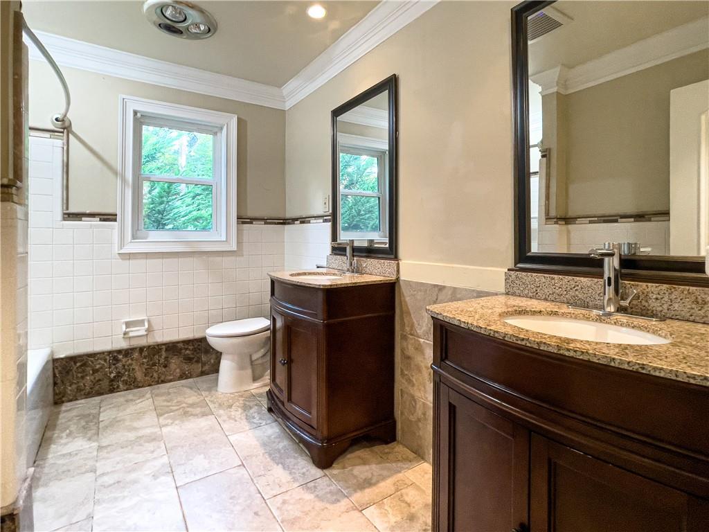 3115 Brookview Road Marietta, GA 30067 - Photo 23 of 31 a kitchen with a sink stove and cabinets
