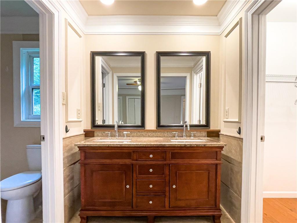 3115 Brookview Road Marietta, GA 30067 - Photo 25 of 31 a bathroom with a granite countertop sink and a mirror