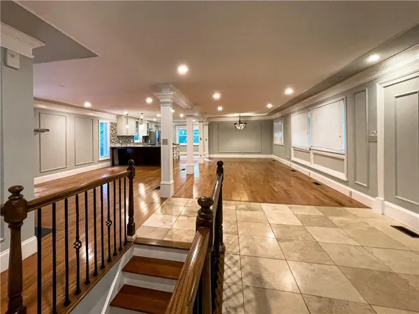 a view of a kitchen with a dinning table and chairs