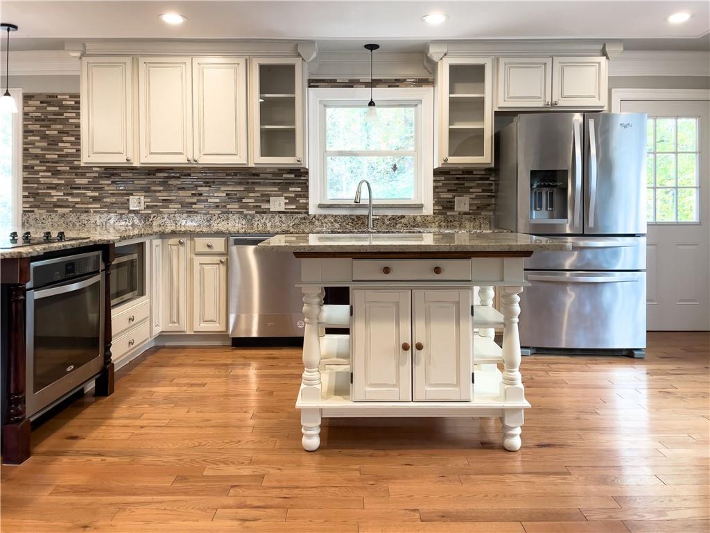 3115 Brookview Road Marietta, GA 30067 - Photo 7 of 31 a kitchen with stainless steel appliances granite countertop a stove a sink and a microwave