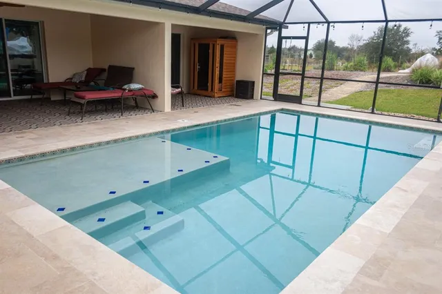 a view of a hallway with entryway wooden floor and front door