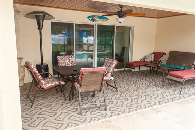 a bedroom with a bed and a refrigerator