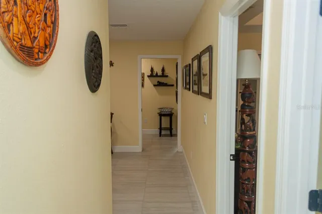 a view of walk in closet with clothes