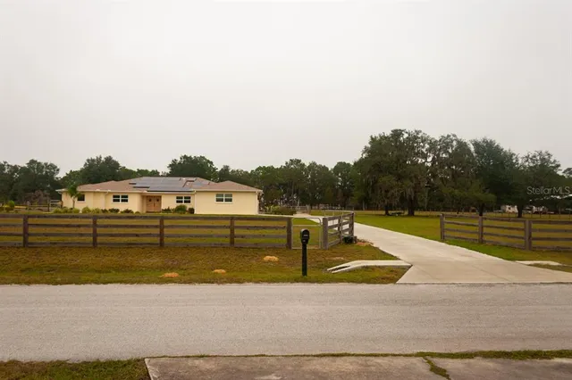 a view of a swimming pool with a yard