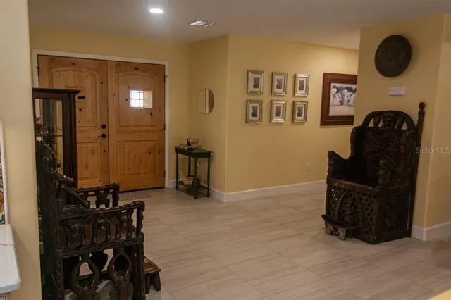 a kitchen with a table and chairs in it