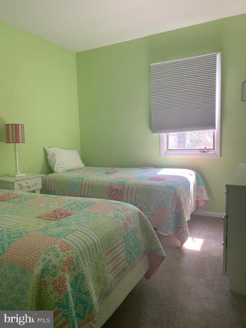 761 Salt Pond Road, Unit A Bethany Beach, DE 19930 - Photo 13 of 16 a bedroom with a bed and window
