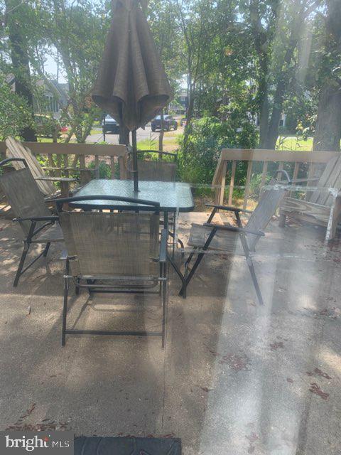 761 Salt Pond Road, Unit A Bethany Beach, DE 19930 - Photo 16 of 16 a table and chairs in the patio