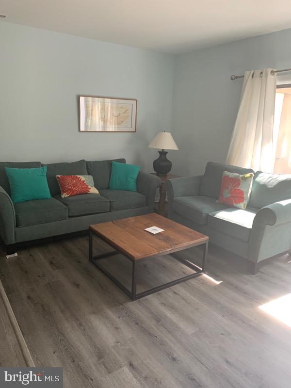 761 Salt Pond Road, Unit A Bethany Beach, DE 19930 - Photo 3 of 16 a living room with furniture and a window