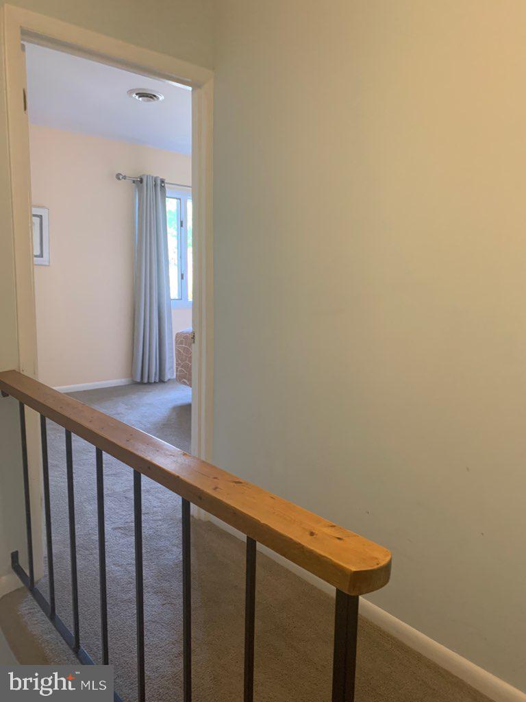 761 Salt Pond Road, Unit A Bethany Beach, DE 19930 - Photo 10 of 16 a view of a hallway with wooden floor
