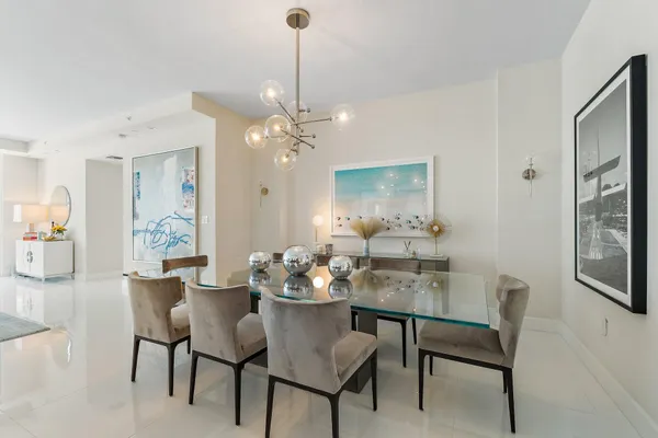a dining room with furniture and window