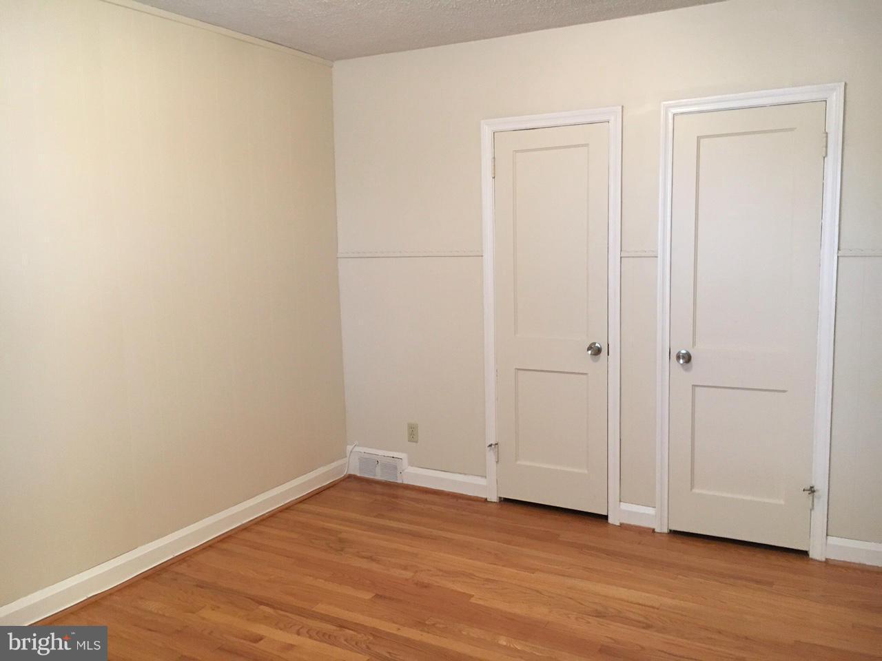 1723 Edgewood Road Baltimore, MD 21286 - Photo 12 of 24 a view of an empty room with wooden floor