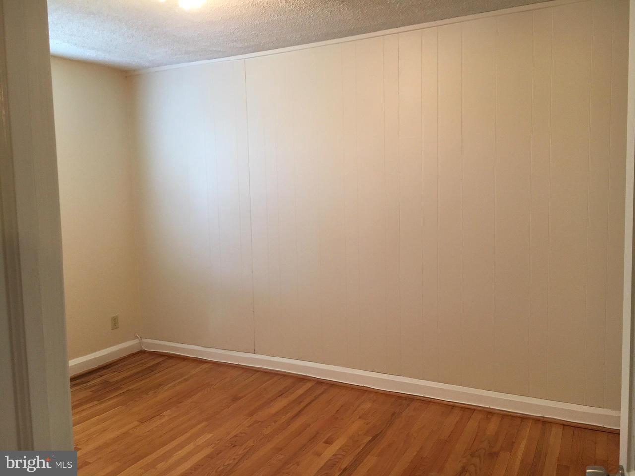 1723 Edgewood Road Baltimore, MD 21286 - Photo 17 of 24 a view of an empty room with wooden floor
