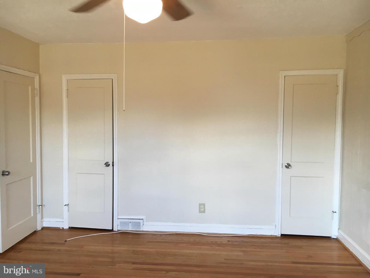 1723 Edgewood Road Baltimore, MD 21286 - Photo 19 of 24 a view of an empty room with wooden floor