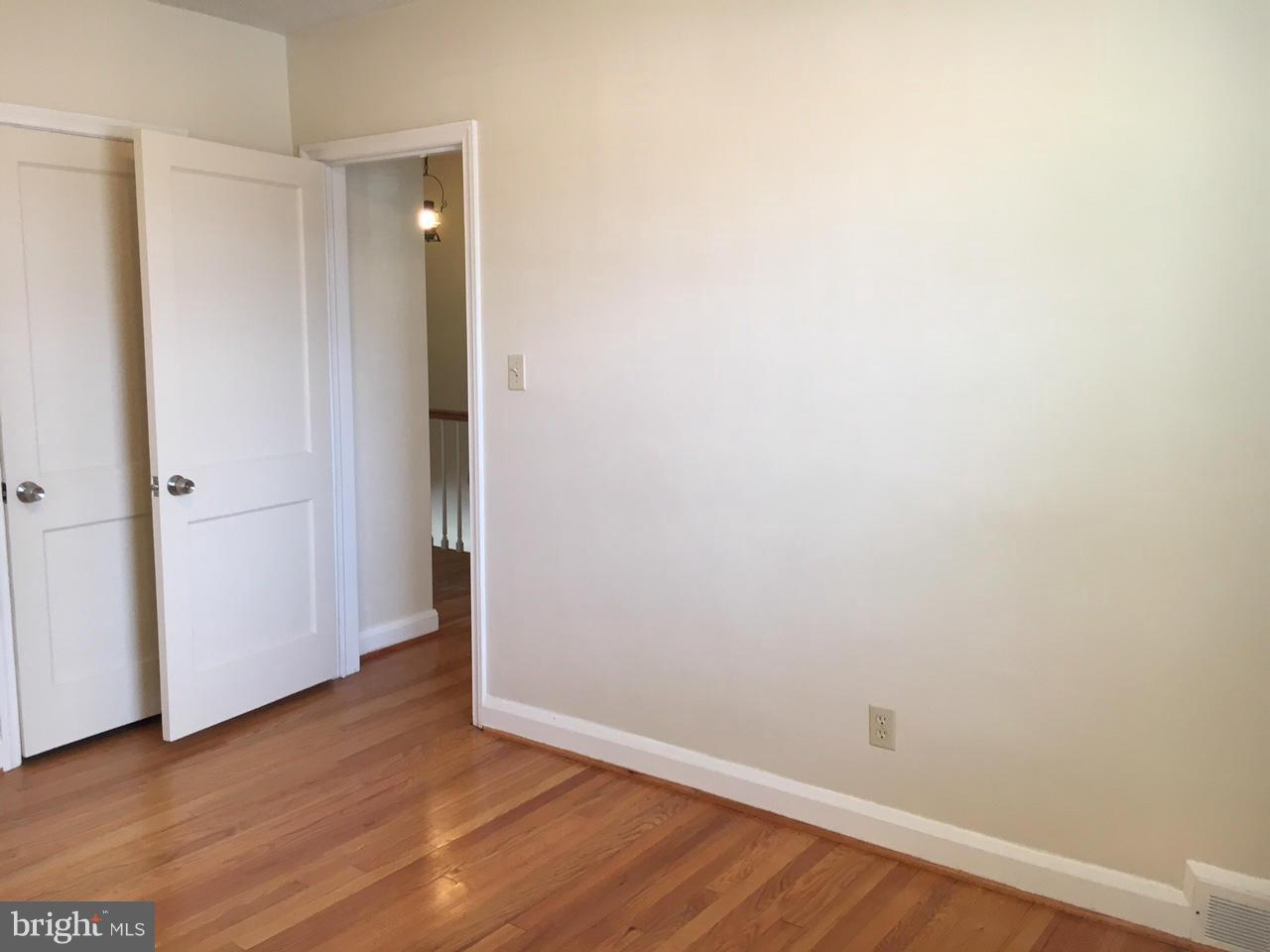 1723 Edgewood Road Baltimore, MD 21286 - Photo 20 of 24 an empty room with wooden floor