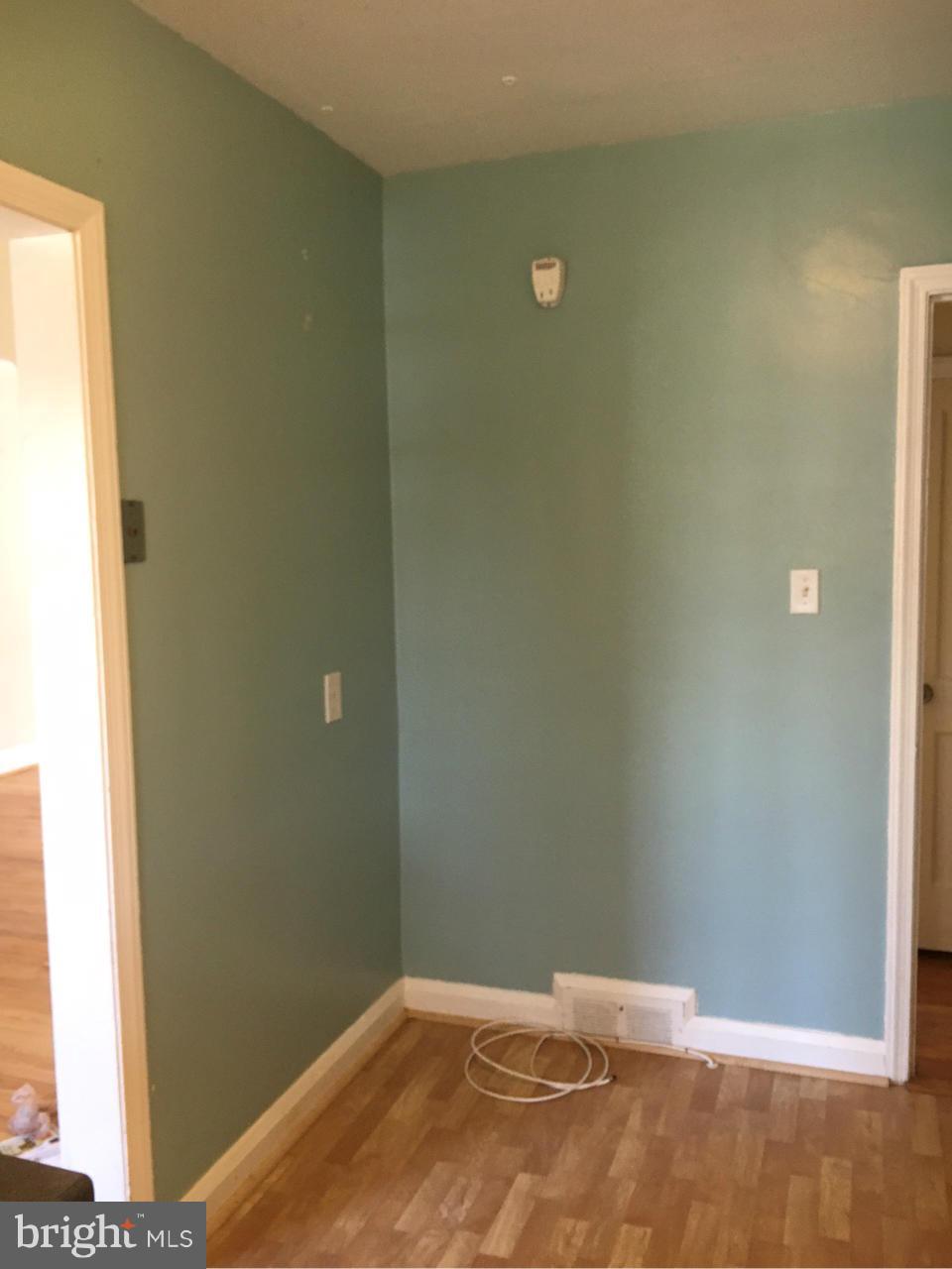 1723 Edgewood Road Baltimore, MD 21286 - Photo 7 of 24 a bedroom with a bed