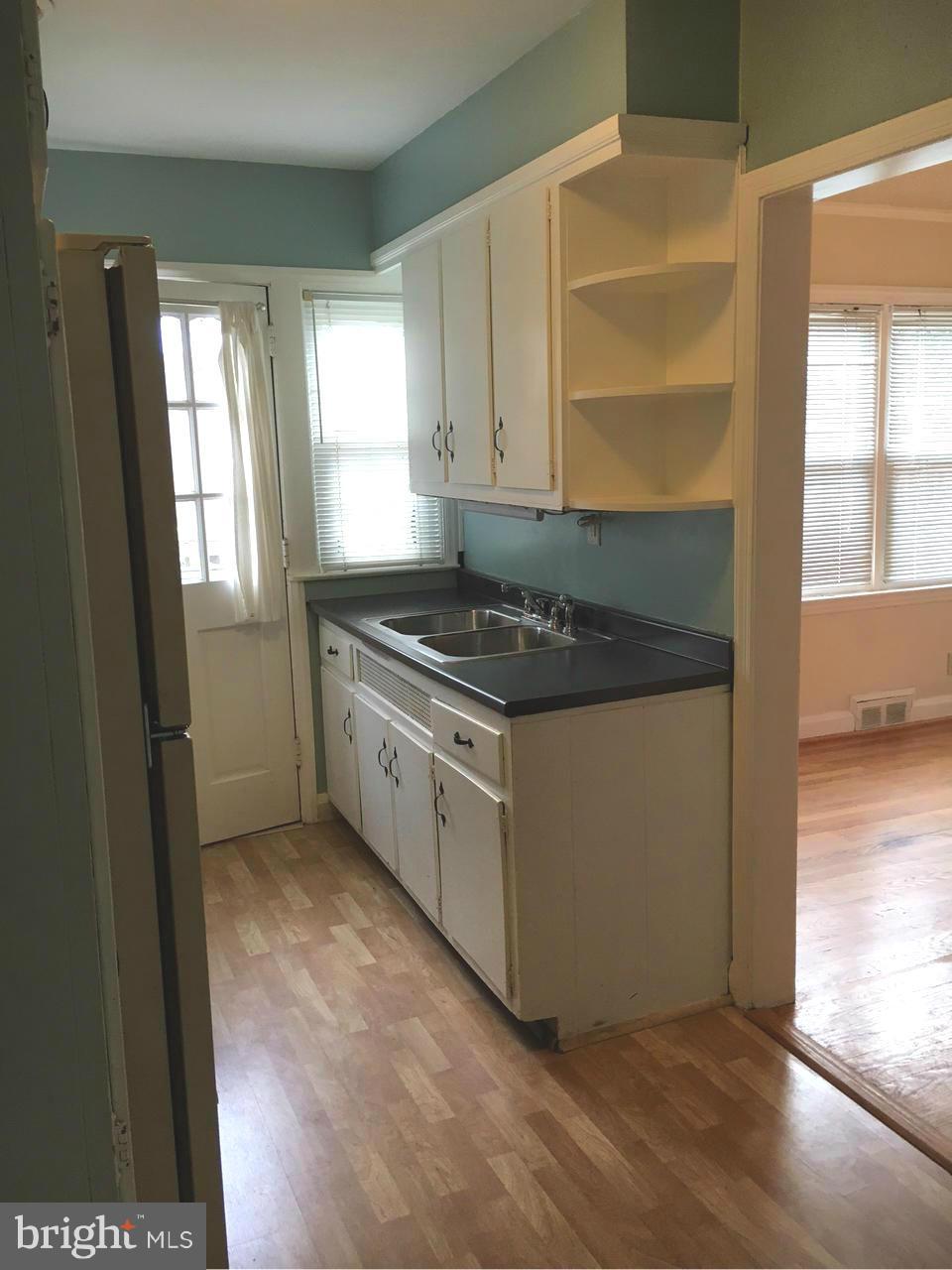 1723 Edgewood Road Baltimore, MD 21286 - Photo 9 of 24 a kitchen with stainless steel appliances granite countertop a stove a sink and a refrigerator