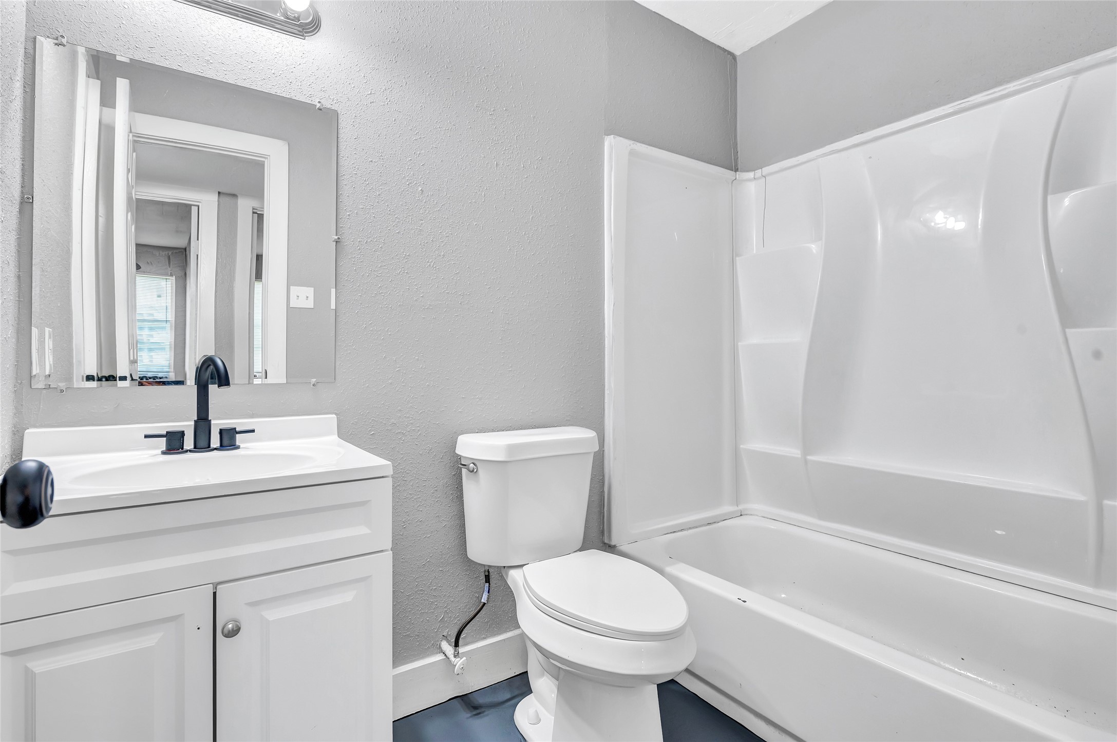 3802 Dabney Street, Unit 15 Houston, TX 77026 - Photo 11 of 13 a bathroom with a sink toilet and shower
