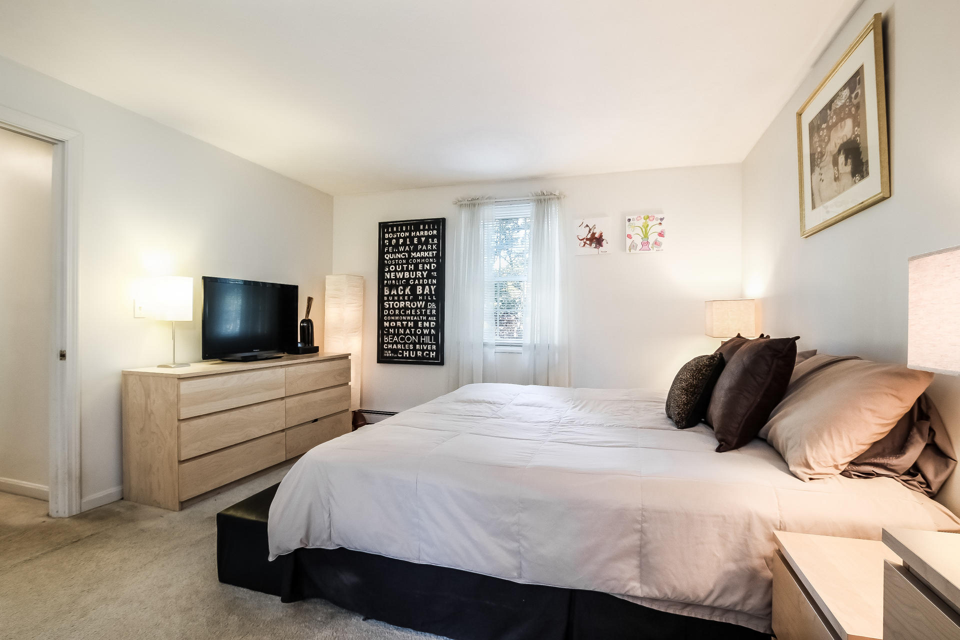 9 Wintergreen Road Mashpee, MA 02649 - Photo 16 of 24 a bedroom with a bed and a flat screen tv